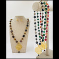 Set de aretes y collar de piedras con dije